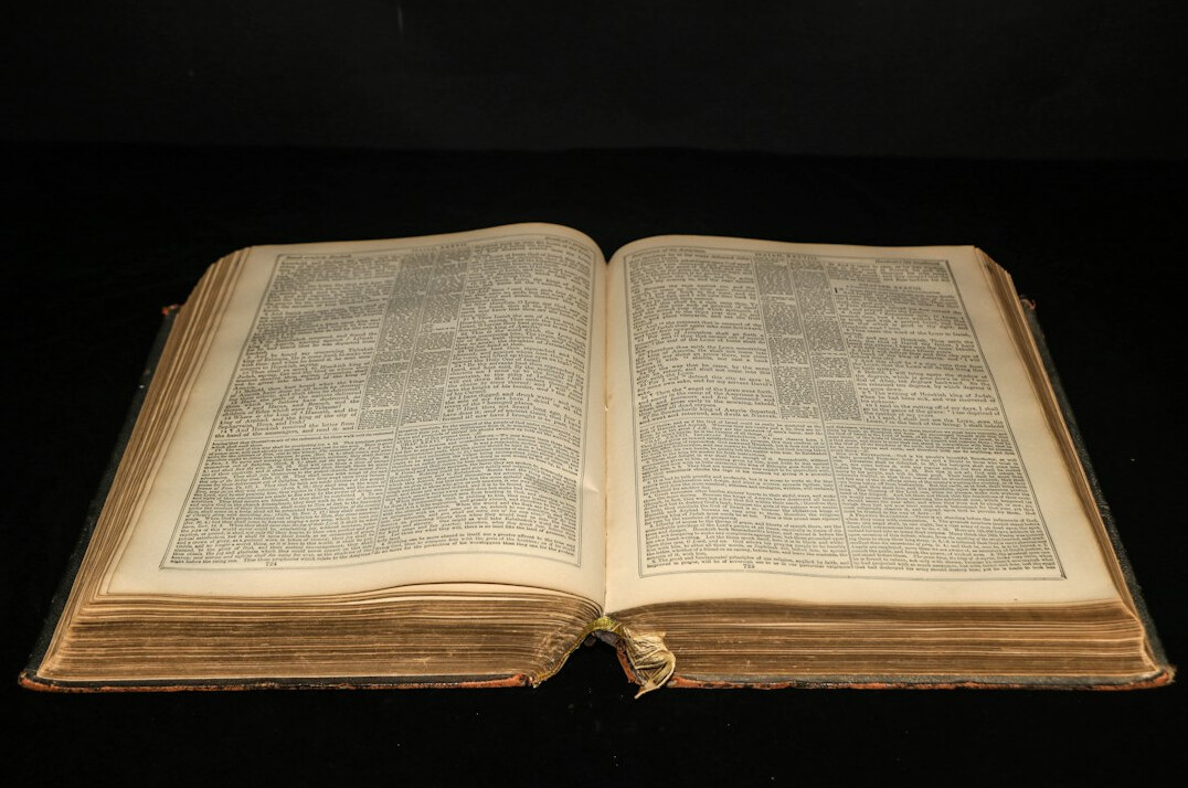 Open old book with yellowed pages