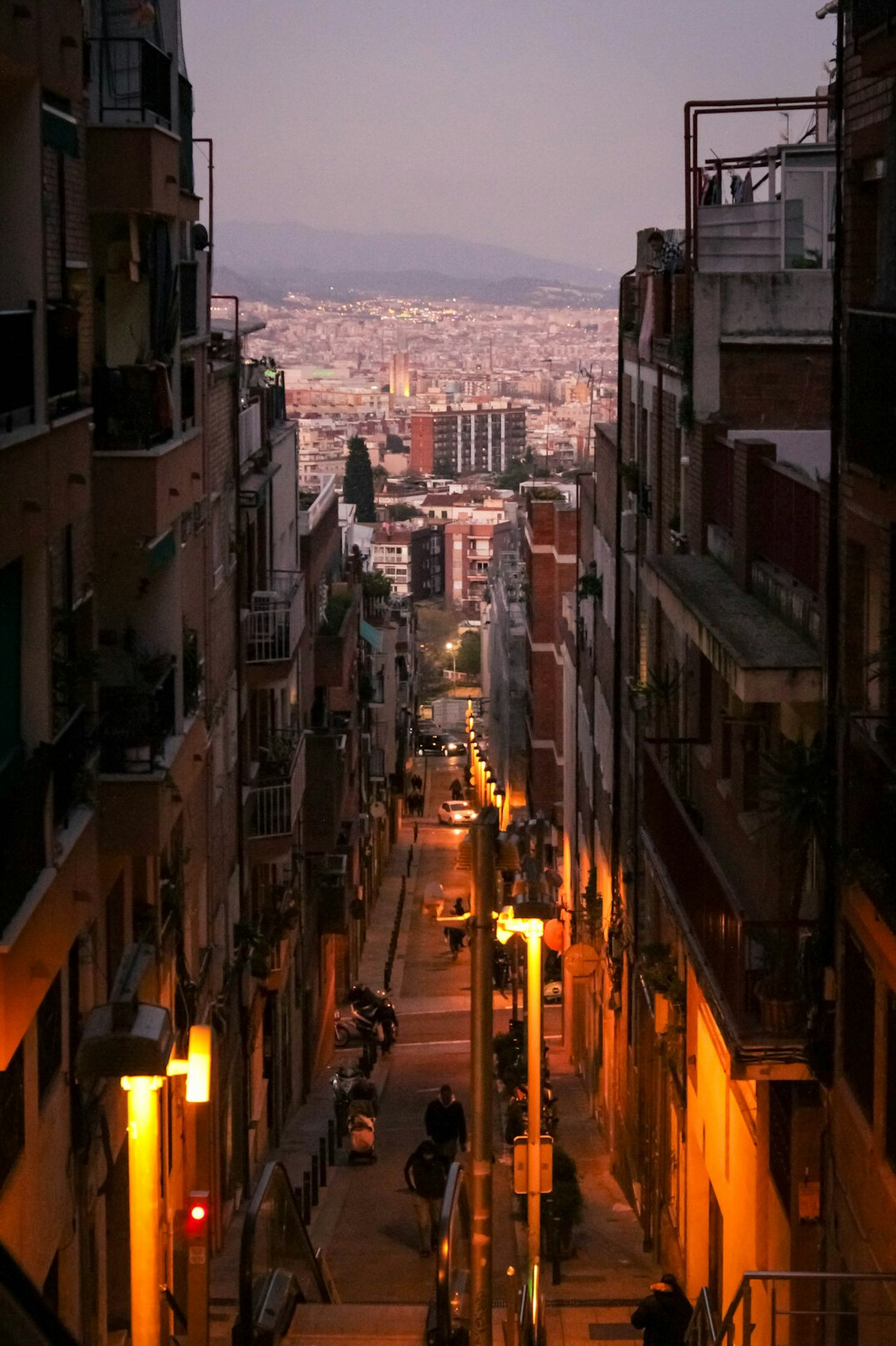 Narrow old European city street at dusk